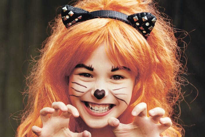young girl in cat halloween costume