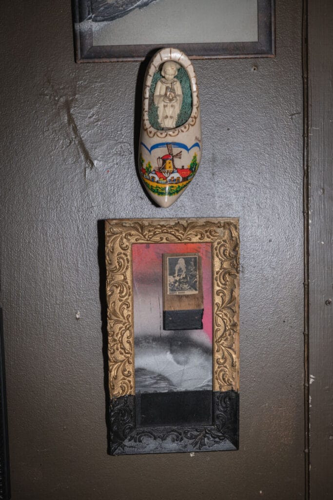 two art peices hanging on wall