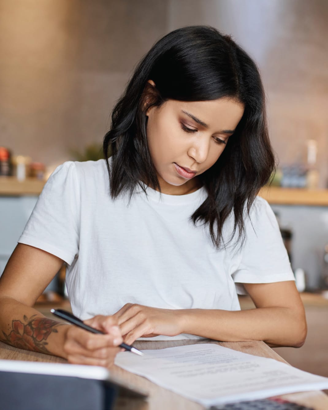 woman filling out paperwork