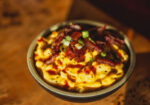 bowl of macncheese with toppings