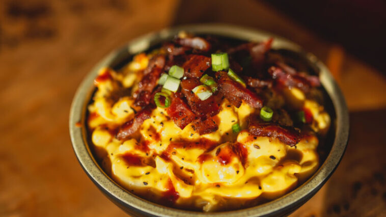 bowl of macncheese with toppings