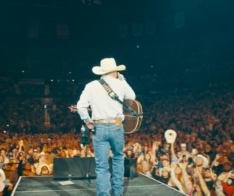 Cody Johnson performing in front of a live stage